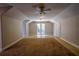 Spacious bonus room with vaulted ceiling, carpet, and French doors at 4962 Lazy Oaks Way, St Cloud, FL 34771