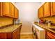 Laundry room with granite countertops and ample cabinet space at 4962 Lazy Oaks Way, St Cloud, FL 34771