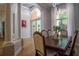 Formal dining room featuring a large table and hardwood floors at 4962 Lazy Oaks Way, St Cloud, FL 34771