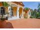Front entrance with covered porch and stamped concrete driveway at 4962 Lazy Oaks Way, St Cloud, FL 34771