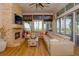 Spacious living room features a stone fireplace, large windows, and comfortable seating at 4962 Lazy Oaks Way, St Cloud, FL 34771