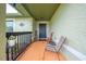 Inviting front porch with two chairs, perfect for relaxing and enjoying the outdoors at 961 Whisler Ct, St Cloud, FL 34769