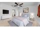 Main bedroom with ceiling fan and ensuite bathroom access at 961 Whisler Ct, St Cloud, FL 34769