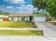 Light green house with two car garage at 961 Whisler Ct, St Cloud, FL 34769