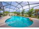 Inviting kidney-shaped pool with screened enclosure at 961 Whisler Ct, St Cloud, FL 34769