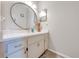 Bathroom with vanity, large mirror, and neutral decor at 961 Whisler Ct, St Cloud, FL 34769