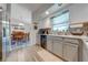 Modern kitchen with stainless steel appliances and dining area view at 961 Whisler Ct, St Cloud, FL 34769