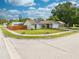 House exterior showcasing front yard, driveway, and street view at 961 Whisler Ct, St Cloud, FL 34769