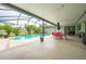 Relaxing pool area with covered patio, table and chairs, great for outdoor entertaining at 961 Whisler Ct, St Cloud, FL 34769