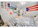 Cozy bedroom with a double bed, TV, and eclectic decor at 961 Whisler Ct, St Cloud, FL 34769