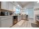 Modern kitchen with gray cabinets, stainless steel appliances, and wine cooler at 961 Whisler Ct, Saint Cloud, FL 34769