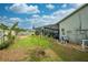 Backyard view with pool, screened enclosure, and grassy area at 961 Whisler Ct, St Cloud, FL 34769