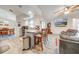Open concept kitchen and living area with wood-look floors at 961 Whisler Ct, St Cloud, FL 34769