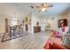 Open and airy living room with wood-look floors and ample natural light at 961 Whisler Ct, St Cloud, FL 34769