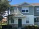 Two-story house with gray siding and green door at 2884 Grasmere View Pkwy, Kissimmee, FL 34746