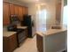 Kitchen features stainless steel appliances and wood cabinets at 2884 Grasmere View Pkwy, Kissimmee, FL 34746