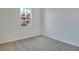Spacious bedroom with neutral carpeting and a large window at 4244 Sawtooth Ct, Tavares, FL 32778