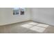 Bright bedroom with carpeted floor and a window offering natural light at 4244 Sawtooth Ct, Tavares, FL 32778