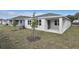Rear view of house showing exterior and landscaping at 4244 Sawtooth Ct, Tavares, FL 32778