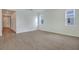 Bright and spacious living room with wood-look tile floors at 4244 Sawtooth Ct, Tavares, FL 32778