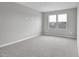 Bright bedroom featuring neutral walls and carpet at 4255 Sawtooth Ct, Tavares, FL 32778