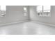 Spacious bedroom with gray walls and white baseboards at 4255 Sawtooth Ct, Tavares, FL 32778