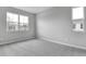 Bright bedroom with gray walls and carpeting at 4255 Sawtooth Ct, Tavares, FL 32778