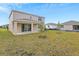 Two-story house with backyard and covered patio at 4255 Sawtooth Ct, Tavares, FL 32778
