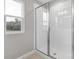 Clean shower with glass enclosure and white tile at 4255 Sawtooth Ct, Tavares, FL 32778
