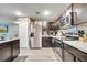 Modern kitchen with stainless steel appliances and dark wood cabinets at 47 Willow Ln, Kissimmee, FL 34759