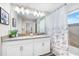 Bathroom with double vanity, shower, and bathtub at 880 Pebble Beach Dr, Davenport, FL 33896