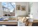 Living room with sectional sofa and view to patio at 880 Pebble Beach Dr, Davenport, FL 33896