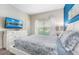 Bedroom with white dresser and TV above the dresser at 880 Pebble Beach Dr, Davenport, FL 33896