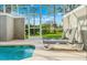 Private pool and patio area with lounge chairs at 880 Pebble Beach Dr, Davenport, FL 33896