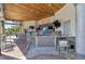 Relaxing pool bar with seating and TVs at 880 Pebble Beach Dr, Davenport, FL 33896
