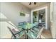 Outdoor patio dining area adjacent to the house at 880 Pebble Beach Dr, Davenport, FL 33896