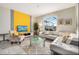 Bright living room with comfy sectional sofa and accent chair at 880 Pebble Beach Dr, Davenport, FL 33896