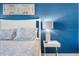 Bedroom detail with white bed frame and bedside table at 880 Pebble Beach Dr, Davenport, FL 33896