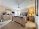 Spacious bedroom with a large bed, dresser, and plenty of natural light at 1038 Orange Cosmos Blvd, Davenport, FL 33837