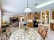 Open kitchen with breakfast nook and view into the living room at 1038 Orange Cosmos Blvd, Davenport, FL 33837