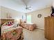 Charming bedroom with twin beds and floral bedding at 1038 Orange Cosmos Blvd, Davenport, FL 33837