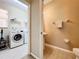 Convenient laundry room with washer, dryer, and extra storage at 1038 Orange Cosmos Blvd, Davenport, FL 33837