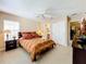 Bright bedroom with a queen-size bed and plenty of natural light at 1038 Orange Cosmos Blvd, Davenport, FL 33837