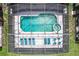 Overhead view of refreshing pool and spa with screened enclosure at 1038 Orange Cosmos Blvd, Davenport, FL 33837