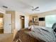 Spacious bedroom with a king-size bed, dresser, and walk-in closet at 1038 Orange Cosmos Blvd, Davenport, FL 33837