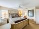 Comfortable bedroom with ensuite bathroom and ample closet space at 1038 Orange Cosmos Blvd, Davenport, FL 33837