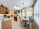 Kitchen nook with round table and chairs, overlooking the backyard at 1038 Orange Cosmos Blvd, Davenport, FL 33837