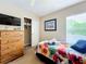 Cozy bedroom with a twin bed and built-in wardrobe at 1038 Orange Cosmos Blvd, Davenport, FL 33837