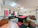 Game room featuring a pool table, foosball, and air hockey for entertainment at 1038 Orange Cosmos Blvd, Davenport, FL 33837