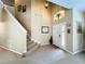 Grand two-story entryway with tiled floors and elegant staircase at 1038 Orange Cosmos Blvd, Davenport, FL 33837